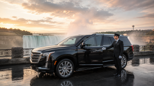 Luxury black executive SUV with chauffeur at Niagara Falls providing premium airport limo service.